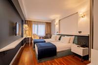 Postel nebo postele na pokoji v ubytování BW Izmir Hotel
