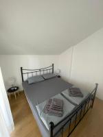Postel nebo postele na pokoji v ubytování Apartman Melinda