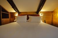 A bed or beds in a room at Ai Due Fanali Adults Only