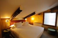 A bed or beds in a room at Ai Due Fanali Adults Only