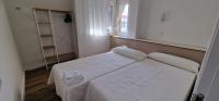 Postel nebo postele na pokoji v ubytování Apartamentos Suaces