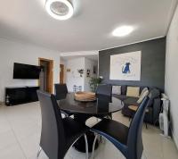 A television and/or entertainment centre at A beautiful pool view apartment - AO1822LT