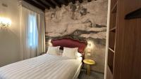A bed or beds in a room at Ai Due Fanali Adults Only