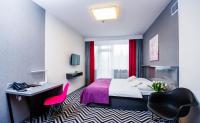Łóżko lub łóżka w pokoju w obiekcie Hotel Wyspiański