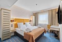 Ein Bett oder Betten in einem Zimmer der Unterkunft Park Hotel Diament Katowice