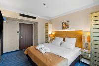Ein Bett oder Betten in einem Zimmer der Unterkunft Park Hotel Diament Katowice