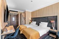Ein Bett oder Betten in einem Zimmer der Unterkunft Park Hotel Diament Katowice