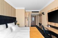 Ein Bett oder Betten in einem Zimmer der Unterkunft Park Hotel Diament Katowice