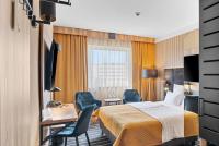 Ein Bett oder Betten in einem Zimmer der Unterkunft Park Hotel Diament Katowice