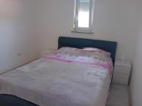 Posteľ alebo postele v izbe v ubytovaní Apartman Dezire