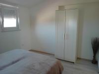 Posteľ alebo postele v izbe v ubytovaní Apartman Dezire