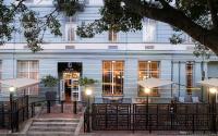 a hotel with tables and chairs in front of a building at ONOMO Hotel Cape Town – Inn On The Square in Cape Town
