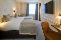 Postel nebo postele na pokoji v ubytování Sloane Square Hotel