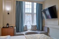 Postel nebo postele na pokoji v ubytování Sloane Square Hotel