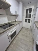 A kitchen or kitchenette at TOP APARTMENT! Frente al mar y gran terraza