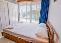 Posteľ alebo postele v izbe v ubytovaní Theodora Apartments