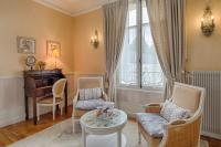 a living room with a table and chairs and a piano at Manoir Du Parc (Adults only) in Amboise