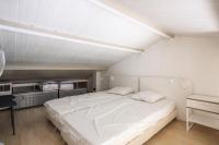 Łóżko lub łóżka w pokoju w obiekcie Les Appartements aux Restanques du Golfe de St Tropez - maeva Home - Appartement avec mezzanine 2 Pièces 4 Personnes - Confort MAE-3700
