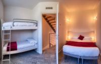 Posteľ alebo postele v izbe v ubytovaní Rainbow Holiday Apartments Lake Como
