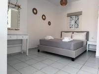 Posteľ alebo postele v izbe v ubytovaní Natalie's apartments