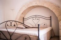 A bed or beds in a room at Residenze nei Trulli