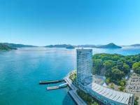 an aerial view of a building next to a body of water at Grand Prince Hotel Hiroshima in Hiroshima