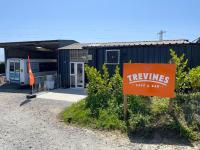a sign in front of a building with a train at Mount View Overnight Accommodation in Penzance