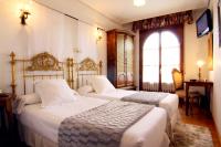 Postel nebo postele na pokoji v ubytování Hotel Merindad de Olite