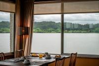 a dining room table with a view of a large window at WOT Pateira Soul in Fermentelos