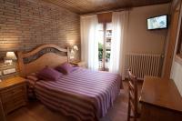 Postel nebo postele na pokoji v ubytování Hotel Sant Roc