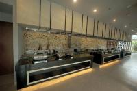 a large kitchen with a bunch of counters at Wyndham Garden Jim Corbett Chhoi in Belparāo