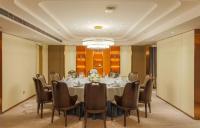 a meeting room with a long table and chairs at Shanghai Sunshine Hotel - Hongqiao Road Subway Station Branch in Shanghai
