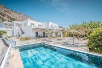 an image of a villa with a swimming pool at Plakia Beach Apartments in Pefki Rhodes