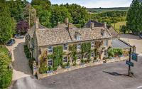 an aerial view of a house with ivy at Inn for All Seasons in Burford