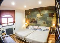 Posteľ alebo postele v izbe v ubytovaní Green Peaks B&B Country House Alojamiento Rural