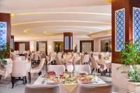 a banquet hall with tables and chairs and food at Pickalbatros Royal Moderna Sharm "Aqua Park"- All inclusive in Sharm El Sheikh