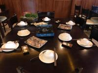 a table with plates of food on top of it at Sapa Sweet Time Hotel in Sa Pa