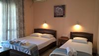A bed or beds in a room at Apartments Palladium