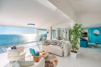 a living room with a view of the ocean at Laguna Blu - Resort Villa overlooking the sea on the Amalfi Coast in Vietri sul Mare