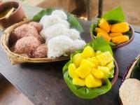 two bowls of food on a table with fruit at Mati Gedara Resort in Digana