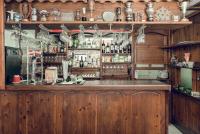 a bar with a lot of bottles and glasses at Complex Popangelov in Borovets