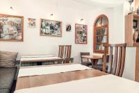 a living room with a table and chairs at Complex Popangelov in Borovets