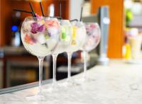 a row of wine glasses sitting on a counter at Cotswold House Hotel and Spa - "A Bespoke Hotel" in Chipping Campden