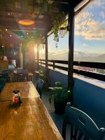 a table in a restaurant with a view of the ocean at Sofia's Unit - 2 Bedroom with complimentary breakfast in Baguio