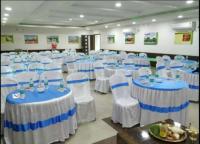 a room with blue and white tables and chairs at Hotel Green Touch Dooars Eco Resort With Fully Facility In Lataguri in Lataguri