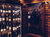 a room filled with lots of bottles of wine at DAHUAM SUITES GERLOS Ski in Appartements mit BalkonITerrasse in Gerlos