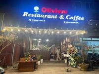 a sign for arestaurant and coffee on the front of a store at Napoli Hostel Cat Ba in Cat Ba