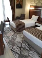 A bed or beds in a room at My Liva Hotel