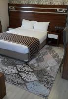A bed or beds in a room at My Liva Hotel