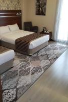 A bed or beds in a room at My Liva Hotel